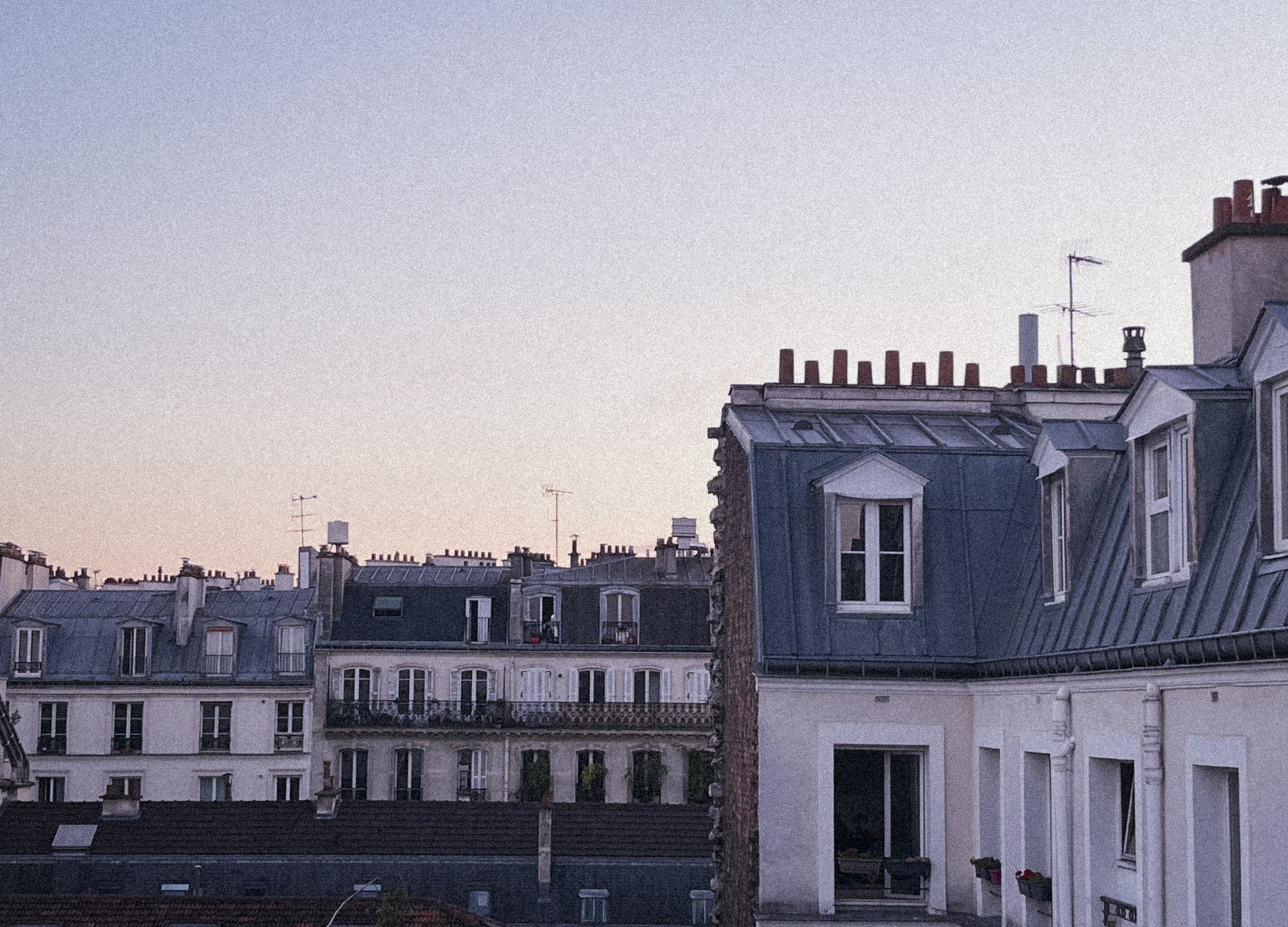 a photograph of rooftops in paris